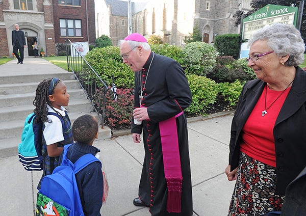 Bishop Richard Malone and Sister Carol Cimino, SSJ, superintendent of Catholic schools, welcome students to class on the first day of school with St. Joseph University School students on Main Street, Buffalo. (Dan Cappellazzo/Staff Photographer)